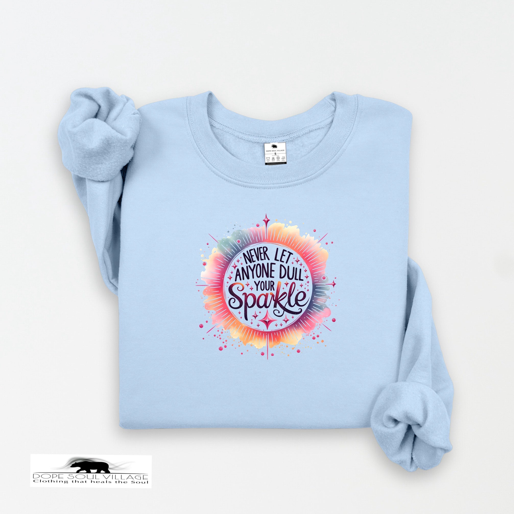 Light blue sweatshirt with colorful graphic and text on a white background