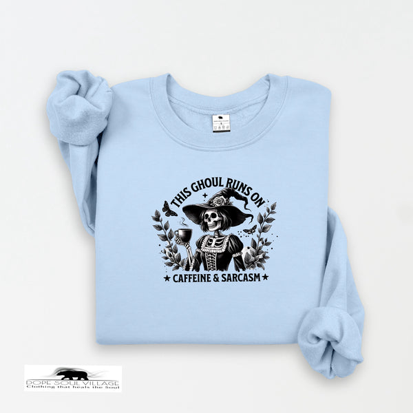 Light blue sweatshirt with a graphic design and text on a white background