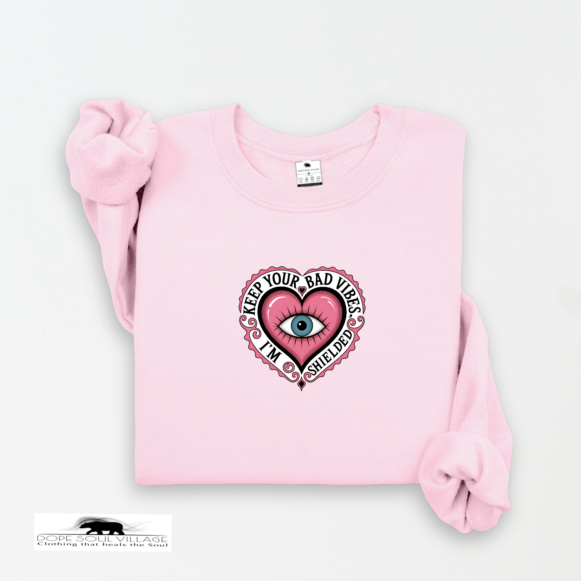 Pink sweatshirt with a graphic design on a white background