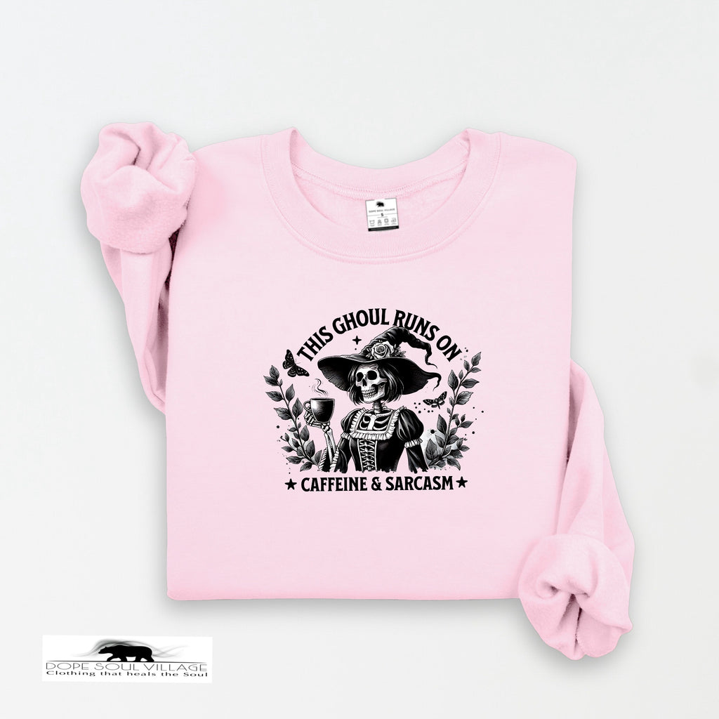 Pink sweatshirt with a graphic design and text on a white background