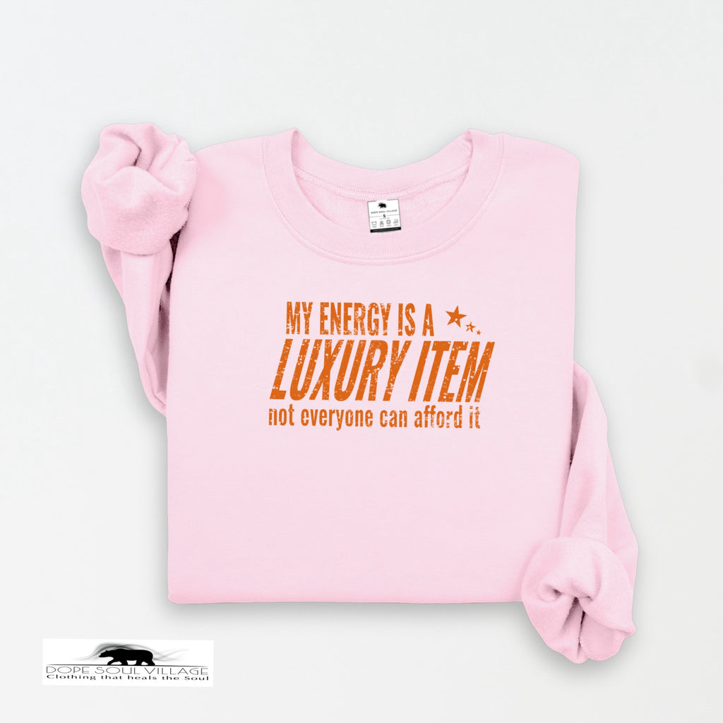 Pink sweatshirt with orange text on a white background