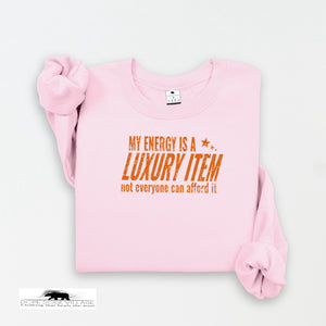 Pink sweatshirt with orange text on a white background