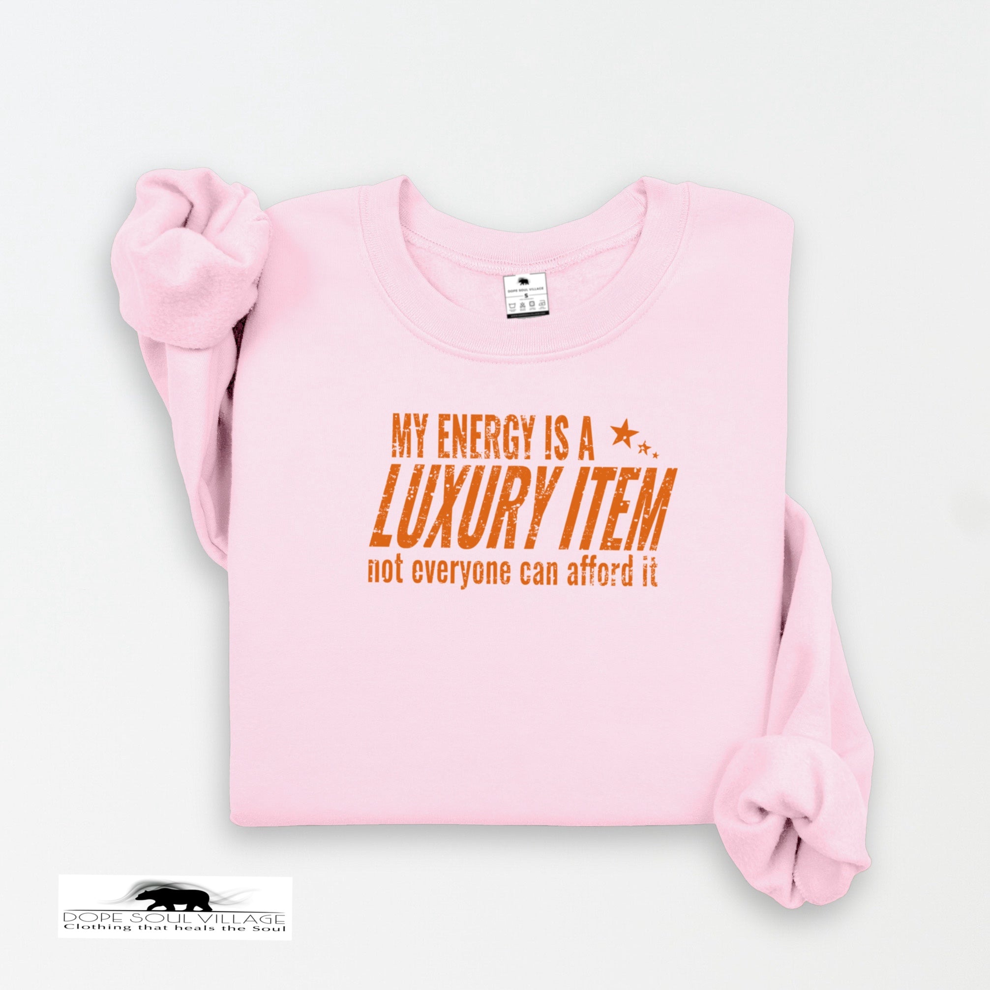 Pink sweatshirt with orange text on a white background