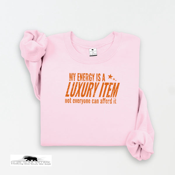 Pink sweatshirt with orange text on a white background