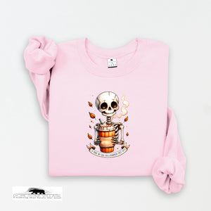 Pink sweatshirt with a skeleton design on a white background