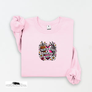 Pink sweatshirt with a graphic design on a white background
