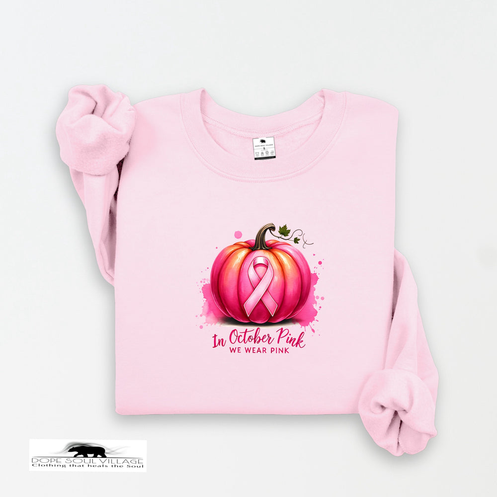 Pink sweatshirt with a pumpkin and pink ribbon design on a white background
