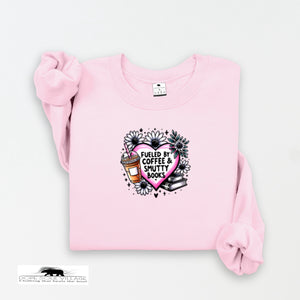 Pink sweatshirt with a graphic design on a white background