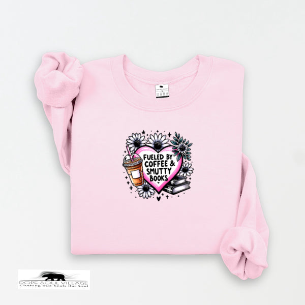 Pink sweatshirt with a graphic design on a white background