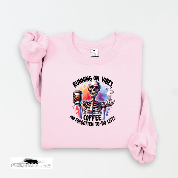 Pink sweatshirt with skeleton design and text on a white background