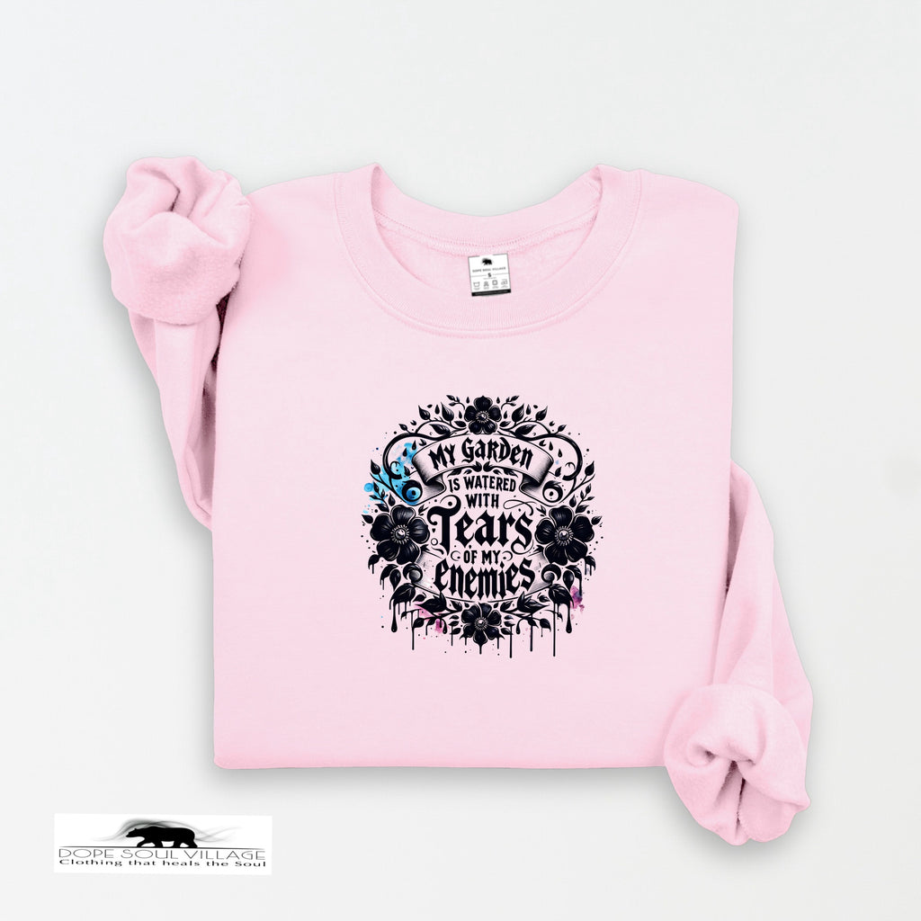 Pink sweatshirt with black graphic design on a white background