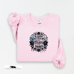 Pink sweatshirt with black graphic design on a white background