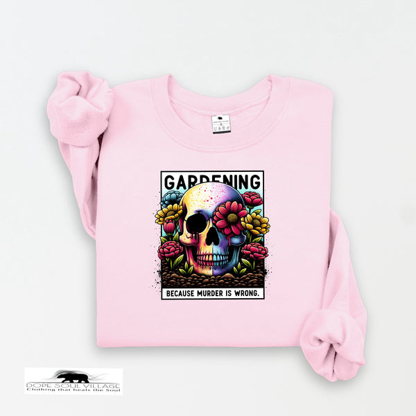 Pink sweatshirt with a colorful skull design and text on a white background