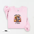 Pink sweatshirt with a raccoon and pumpkin design on a white background