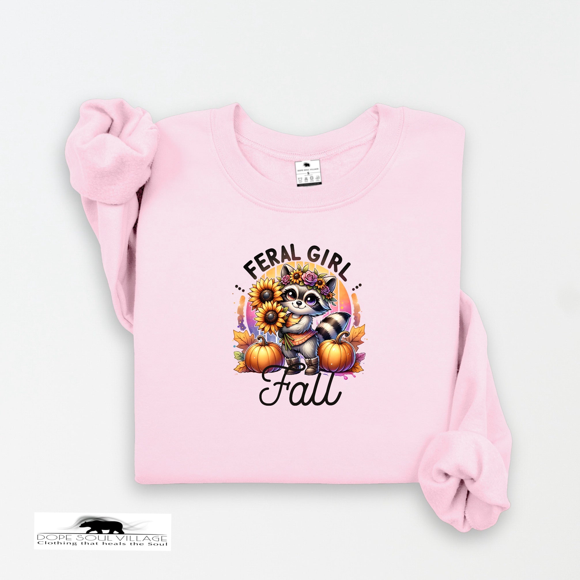 Pink sweatshirt with a raccoon and pumpkin design on a white background