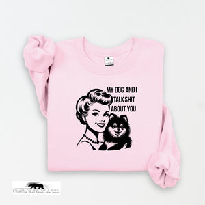 Pink sweatshirt with graphic design and text on a white background