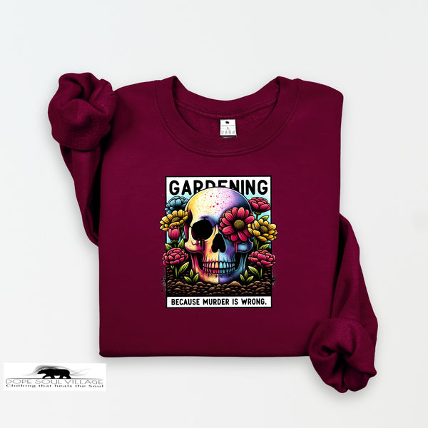 Maroon sweatshirt with a colorful skull design and text on a white background