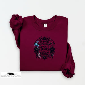 Maroon sweatshirt with black graphic design on a white background