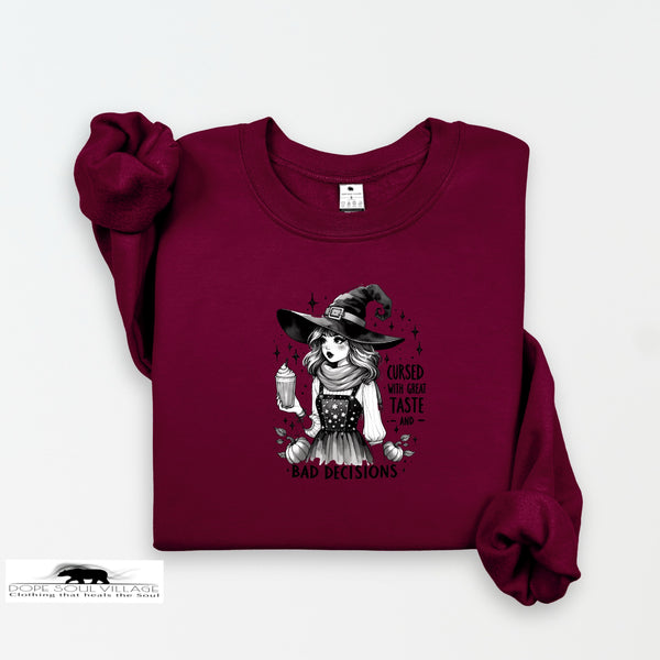 Maroon sweatshirt with a witch graphic and text on a white background