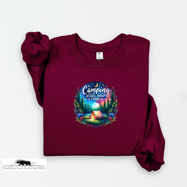 Maroon sweatshirt with a colorful camping graphic and text on a white background