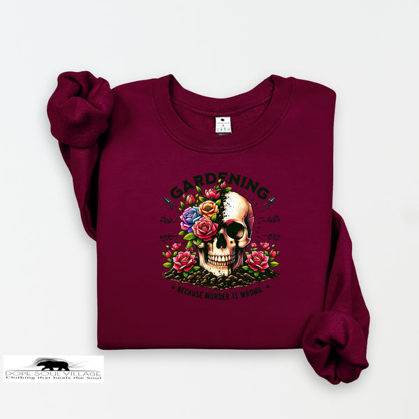 Maroon sweatshirt with a skull and floral design on a white background