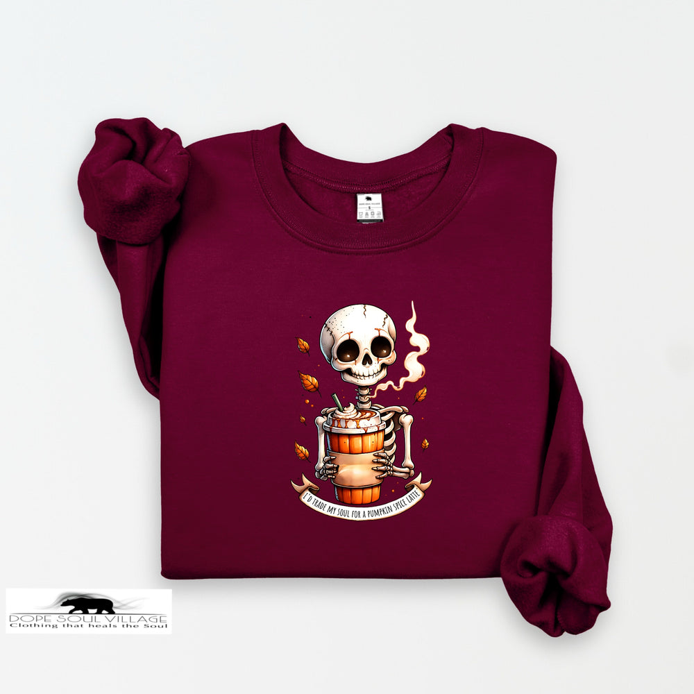 Maroon sweatshirt with a skeleton design holding a pumpkin spice latte on a white background