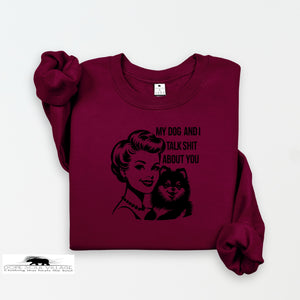 Maroon sweatshirt with graphic design and text on a white background