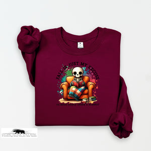 Maroon sweatshirt with a skeleton design on a white background