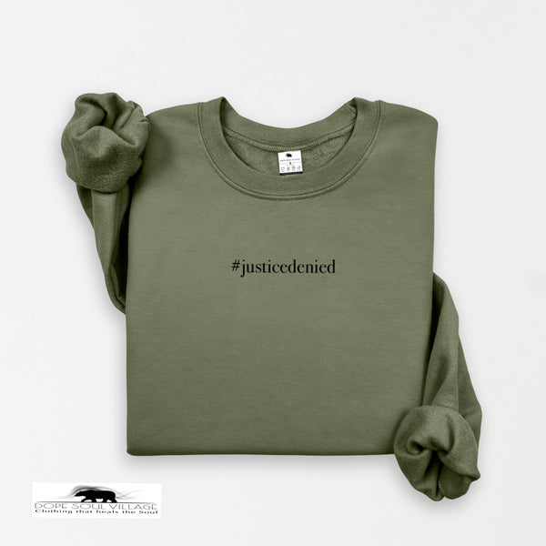 Green sweatshirt with '#justicedenied' text on a white background rebecca goodwin