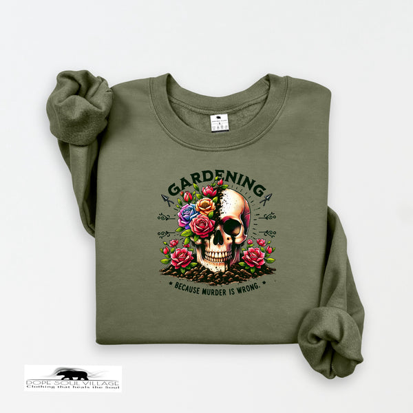 Green sweatshirt with skull and floral design on a white background