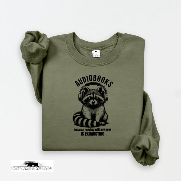 Green sweatshirt with raccoon graphic and text on a white background