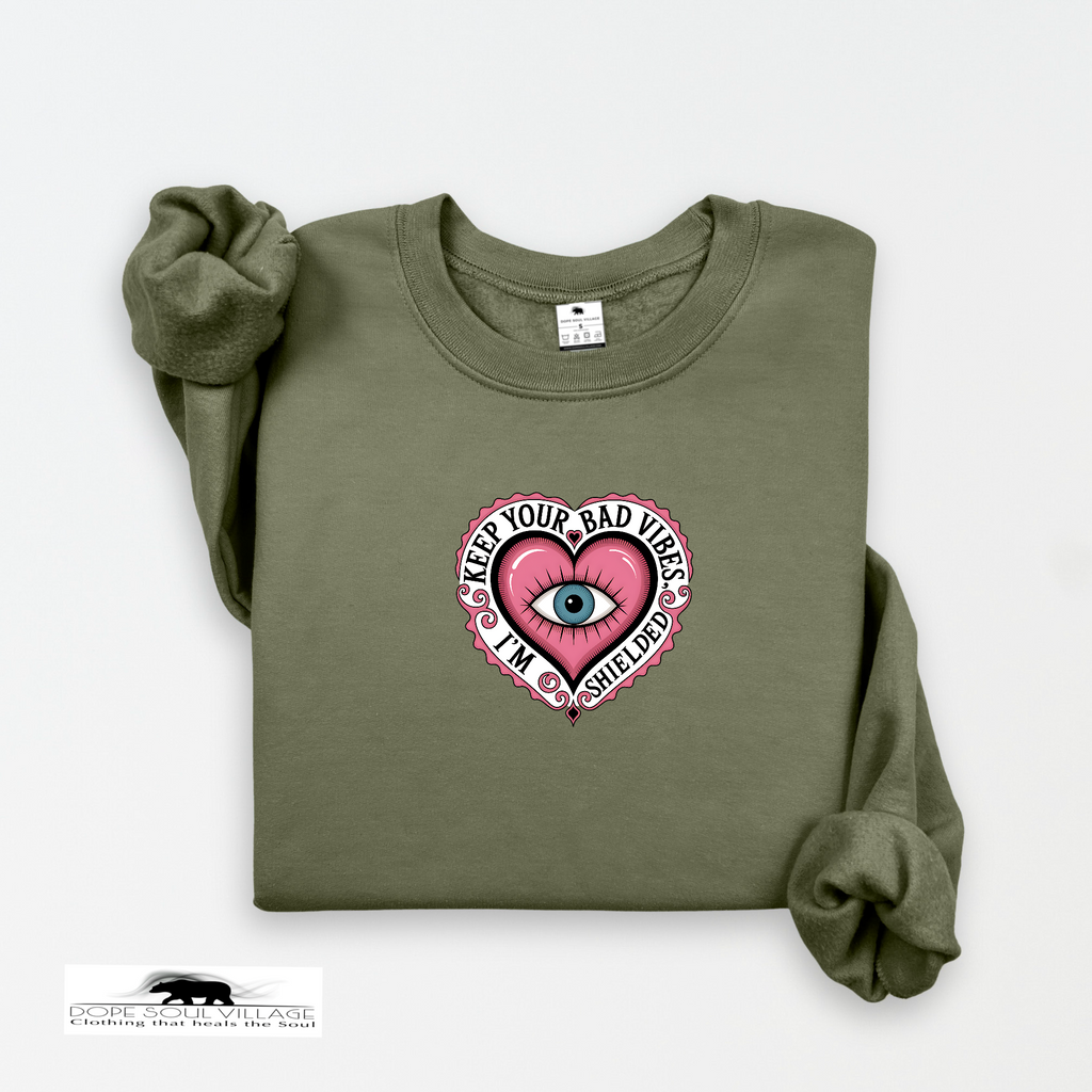 Green sweatshirt with a graphic design on a white background