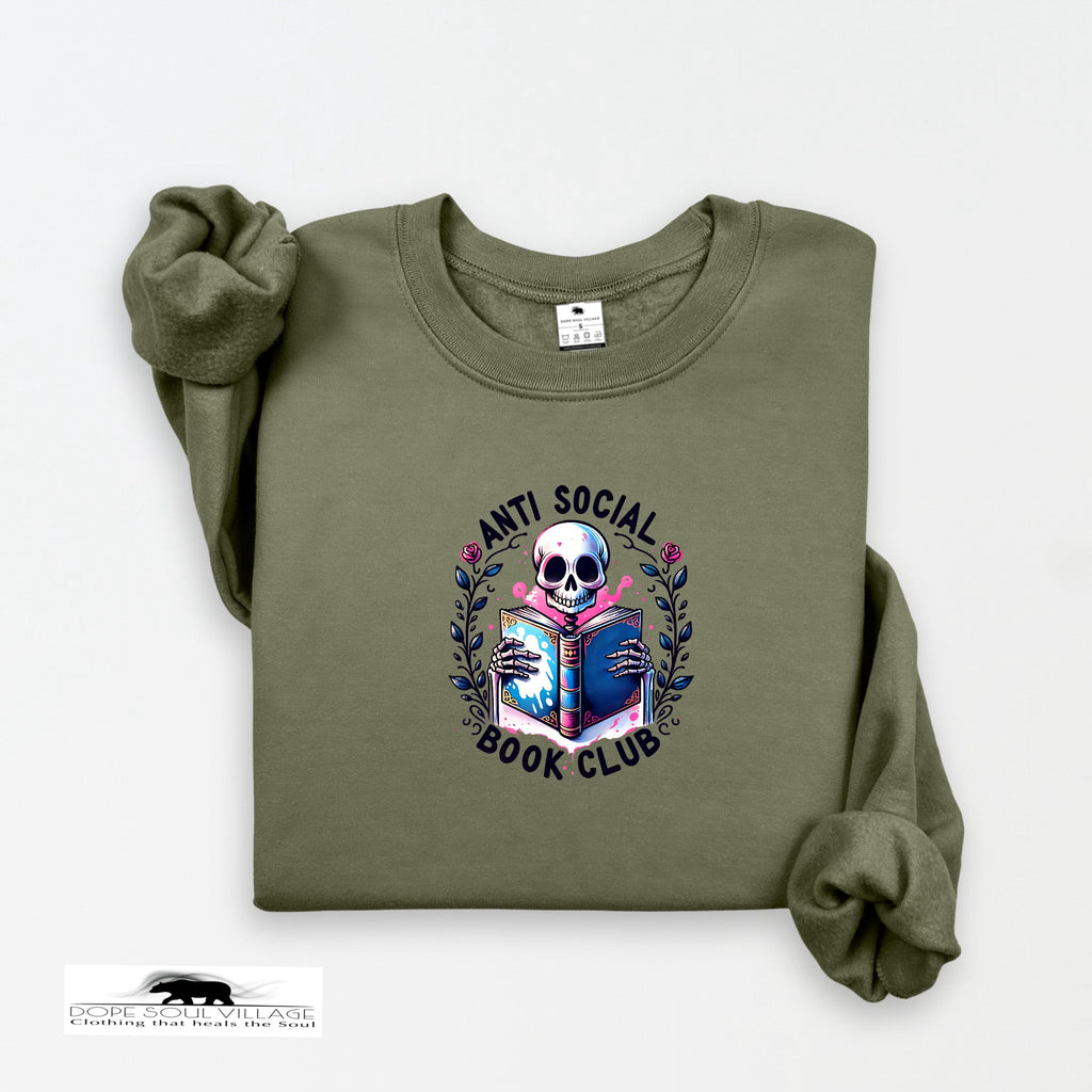 Green sweatshirt with 'Anti Social Book Club' design featuring a skull reading a book on a white background.