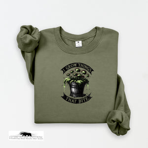 Green sweatshirt with graphic design and text on a white background