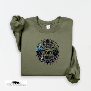 Green sweatshirt with black graphic design on a white background
