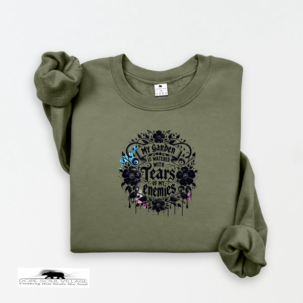 Green sweatshirt with black graphic design on a white background