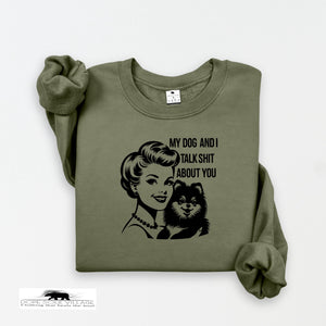 Green sweatshirt with graphic of a woman and dog and text on a white background