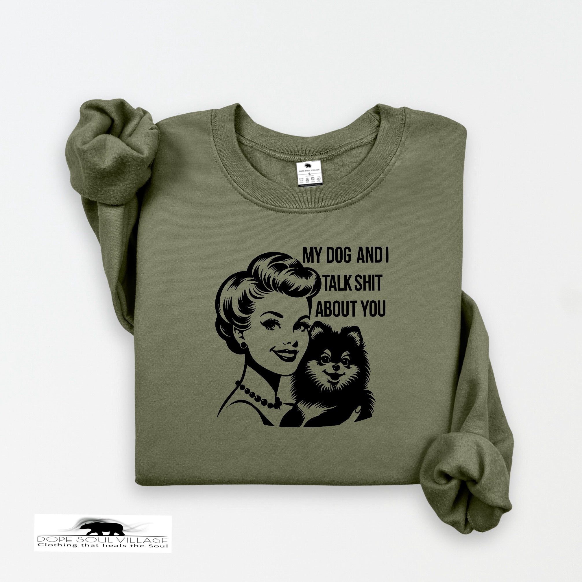 Green sweatshirt with graphic of a woman and dog and text on a white background