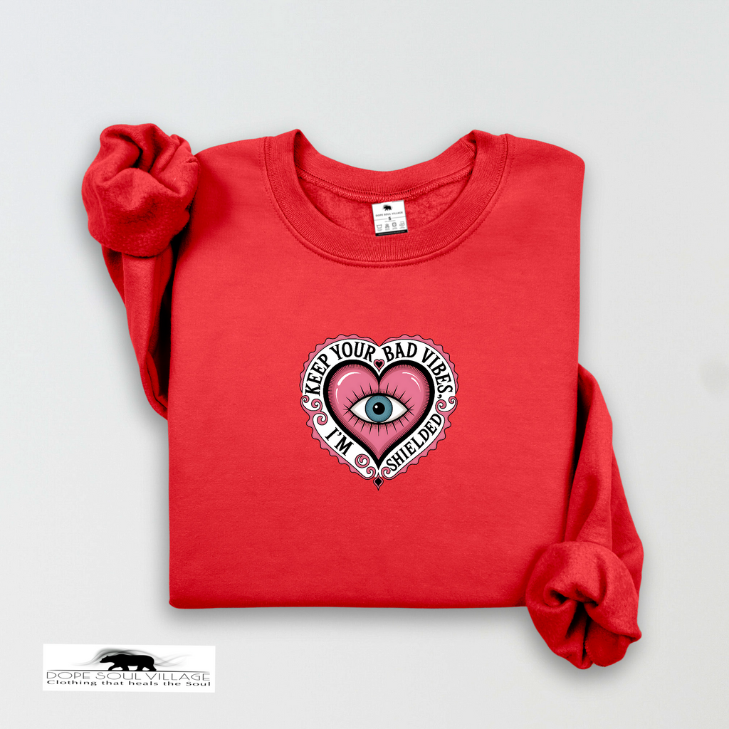 Red sweatshirt with a heart design and text on a light gray background