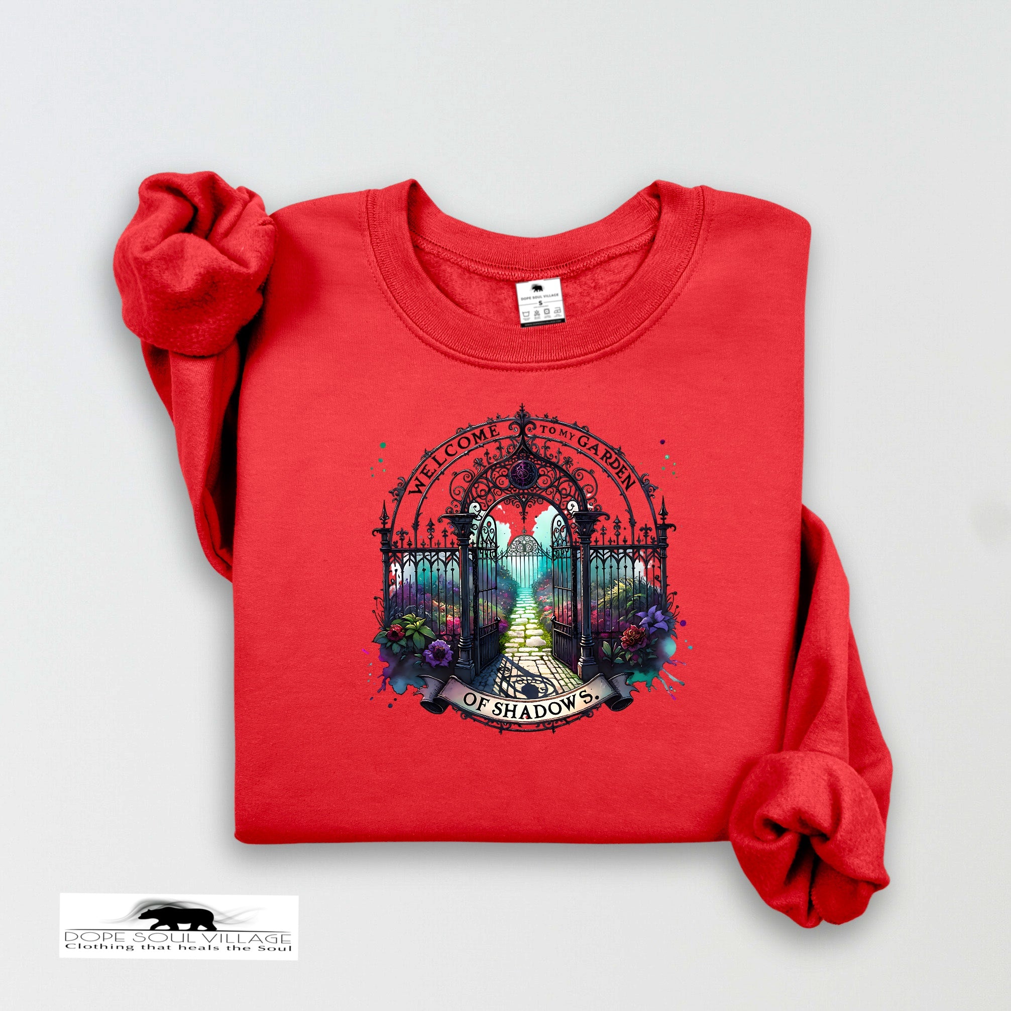 Red sweatshirt with a gate design and text on a white background