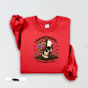 Red t-shirt with a skull and floral design on a white background