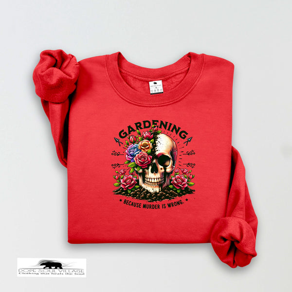 Red t-shirt with a skull and floral design on a white background