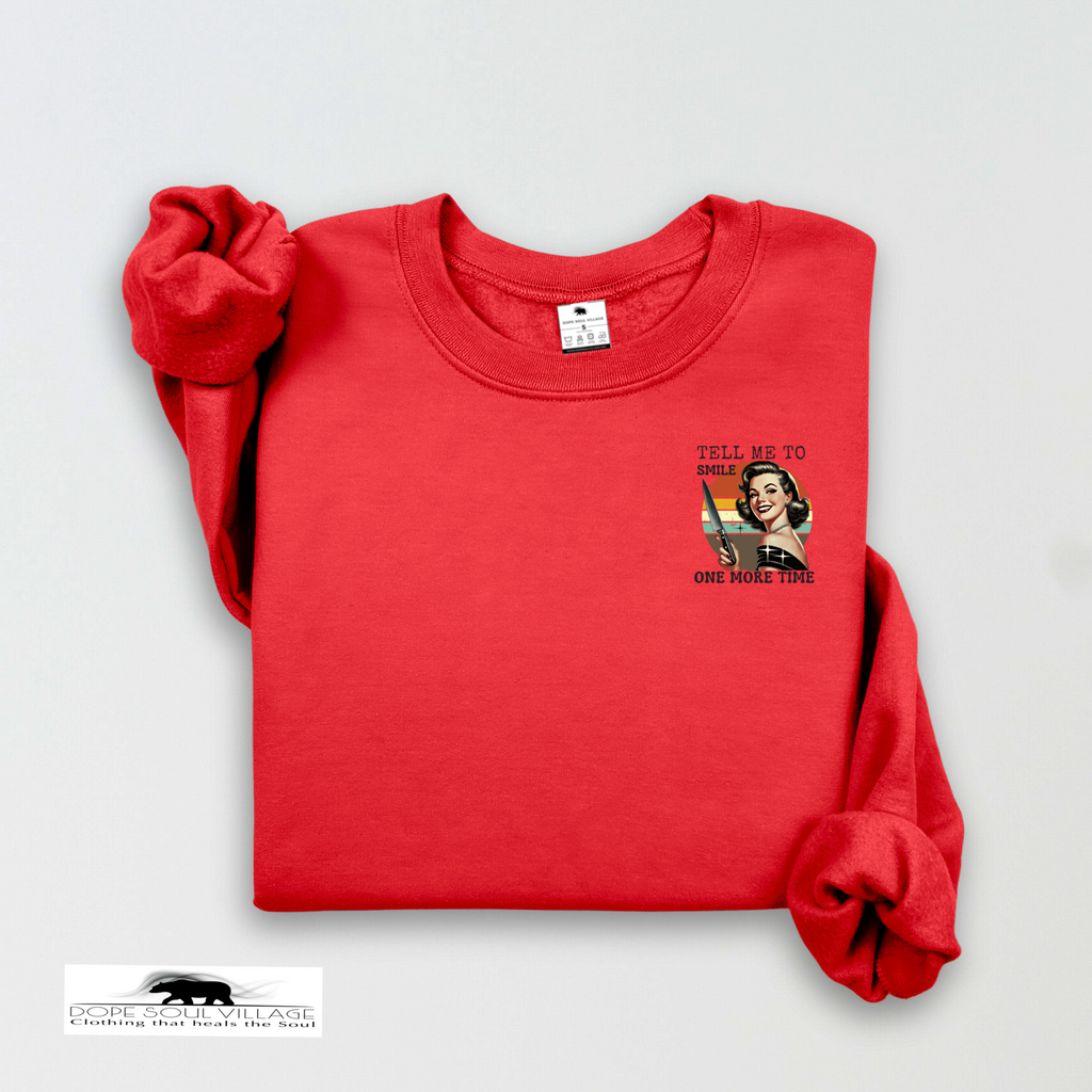 Red sweatshirt with graphic design on a light gray background