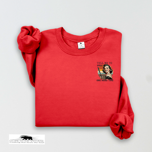 Red sweatshirt with graphic design on a light gray background