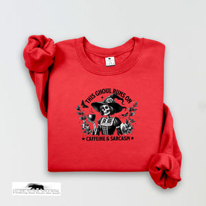 Red sweatshirt with a graphic design and text on a white background