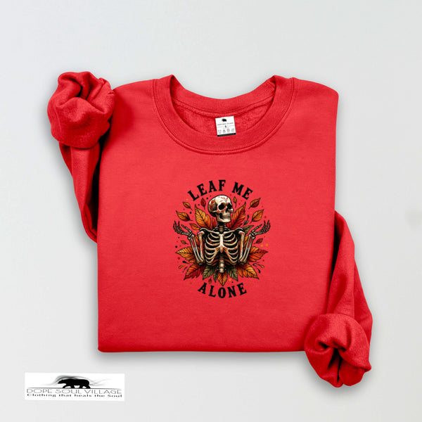 Red sweatshirt with a skeleton and leaf design on a white background