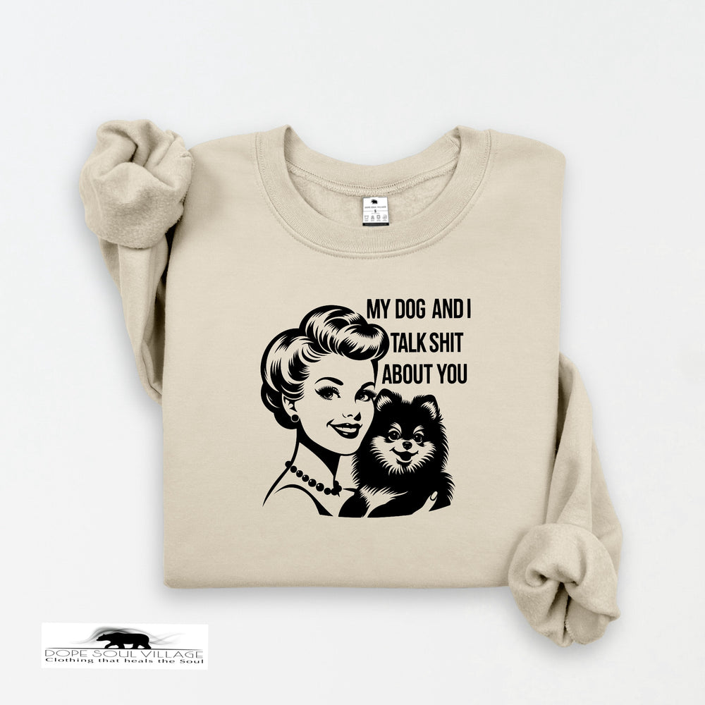 Beige sweatshirt with graphic design of a woman and dog, and text on a white background