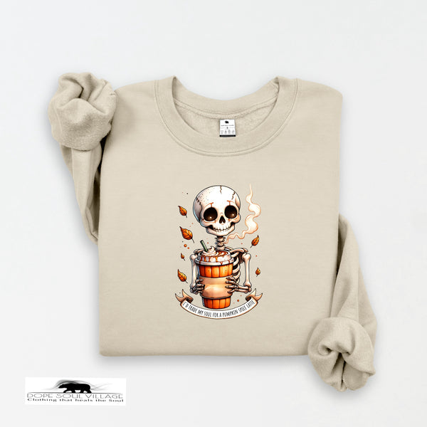 Beige sweatshirt with a skeleton design holding a pumpkin on a white background