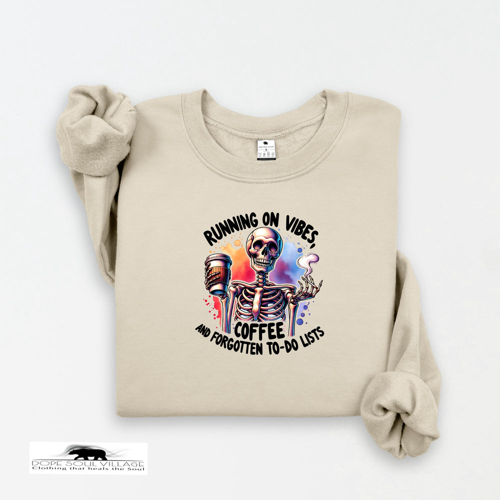 Beige sweatshirt with skeleton design and text on a white background