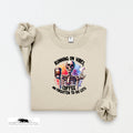 Beige sweatshirt with skeleton design and text on a white background